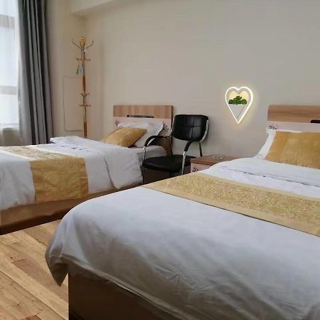 Xinming Fashion Hotel Yanji Bagian luar foto